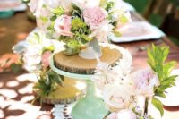 04 table centerpieces with various florals and greenery