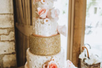 06 The wedding cake perfectly matched the wedding color scheme with peachy pink and gold glitter
