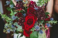 06 winter-inspired bouquet with dark red roses and blue thistle