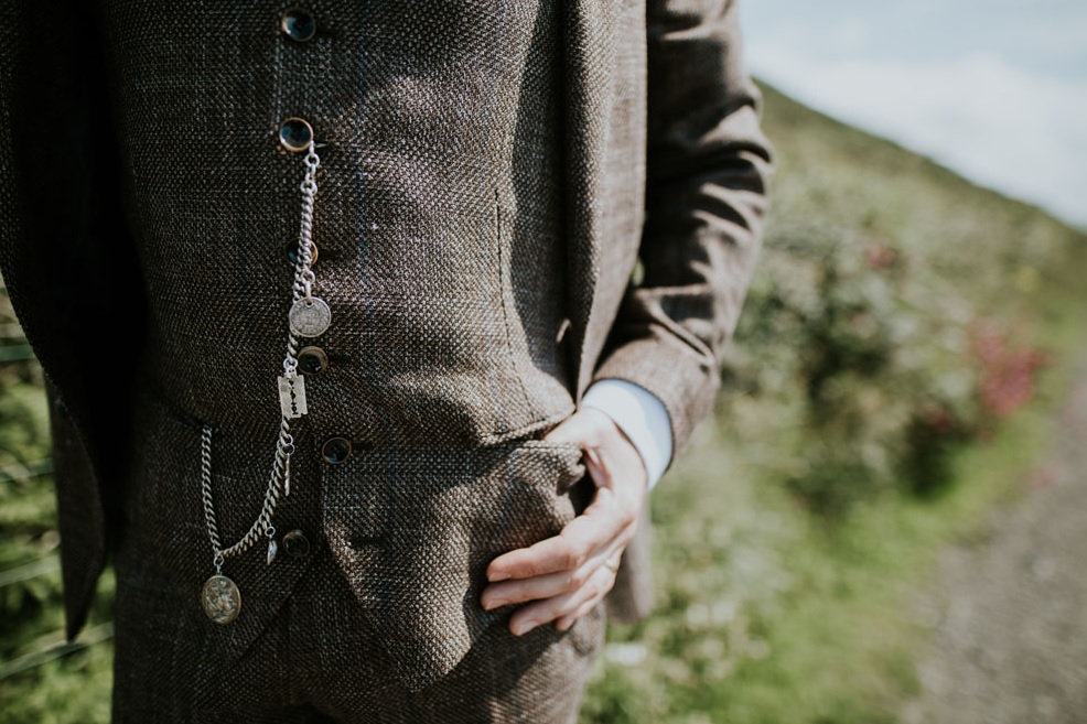 The groom was rocking a tweed suit and some vintage accessories