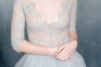 07 dove grey wedding dress with a lace bodice and a deep V-neck and a plain skirt
