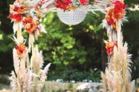 08 pampas grass arch with bold flowers looks stunning