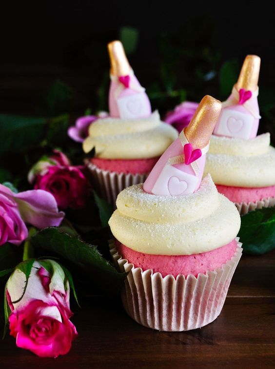 pink champagne cupcakes topped with bottle candies