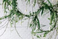 10 decorated with fern leaves and vines, these hanging centerpieces bring a little vibrancy to a minimalist tablescape