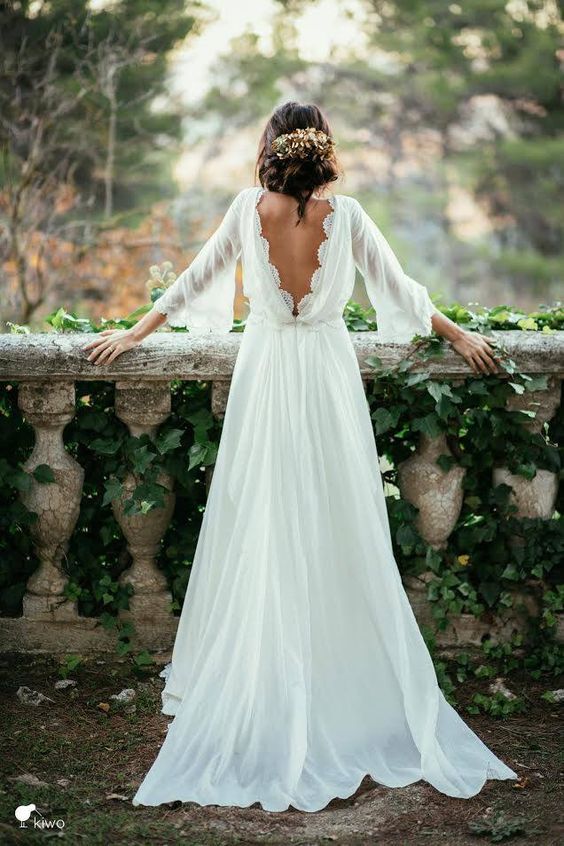 vintage-inspired wedding dress with sleeves and a cutout lace V back
