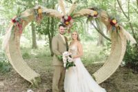 10 woven wedding arch with bold flowers and pampas
