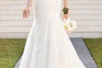 11 fit and flare wedding dress with an illusion back and a zip under the buttons