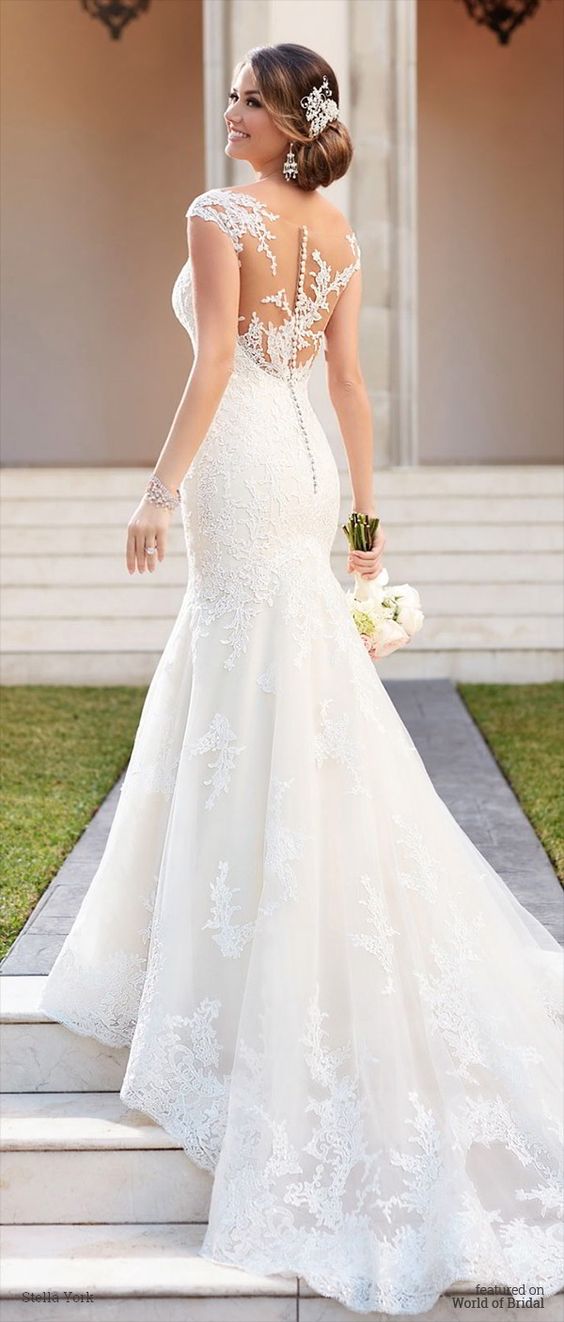 fit and flare wedding dress with an illusion back and a zip under the buttons