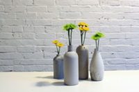 11 modern rough concrete vases with bold florals