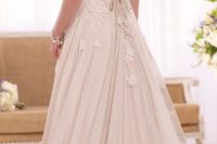 12 blush wedding gown with an illusion back and buttons as detailing