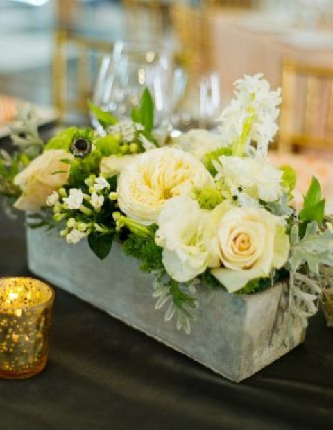 concrete planter with lush florals and greenery
