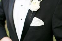 14 elegant black tuxedo with a white flower boutonniere