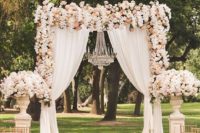 14 stunning blush, peach and ivory floral wedding arch with curtains