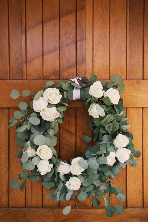 eucalyptus and white roses wedding wreath is a romantic decoration