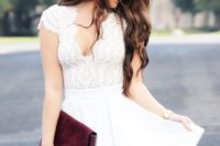 16 white mini dress with a flare skirt and a lace bodice with cap sleeves and a V-neckline