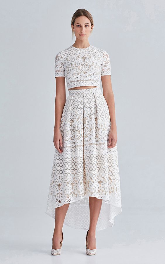 lace separate with a short sleeve crop top and a high low skirt