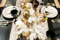 19 lush black, white and gold table decor with lots of florals and gilded driftwood