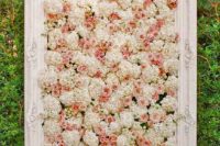20 framed ivory and peach pink flower wall as a wedding backdrop