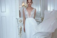 20 lace plunging neckline wedding dress with a flowy skirt