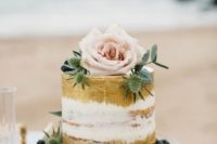 20 semi naked gold painted wedding cake with blueberry, thistle and a rose