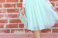 21 a lace top, a full tulle bloom skirt in mint green, a sequin clutch and neutral pumps