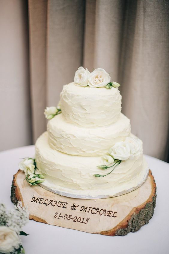 large wood slice for the wedding cake, with names and a date