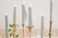 22 dove grey candles in gold candle sticks and ethereal fabric table runner