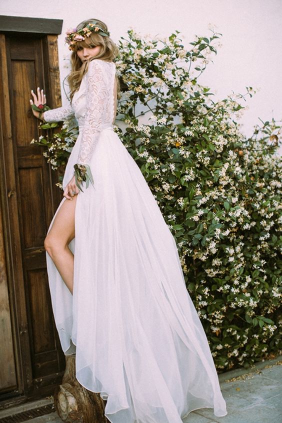 lace wedding dress with long sleeves, a cutout back and a thigh-high slit