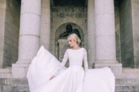 22 long sleeve wedding dress with a lace bodice and a flowy plain skirt