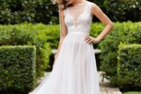 24 illusion plunging neckline bodice and a flowy skirt