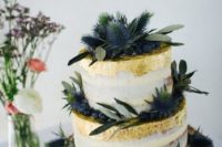 24 two tier semi naked cake decorated with gold leaf, blueberries and thistles