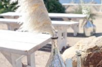 25 beach wedding aisle with pampas grass in mercury glass bottles