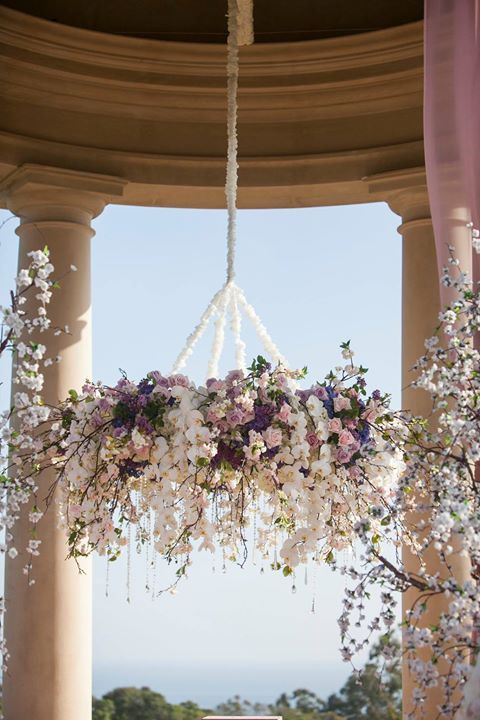 this pastel pink and purple floral chandelier is perfect for a lavish wedding