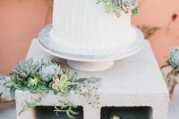 27 concrete cake stand decorated with succulents