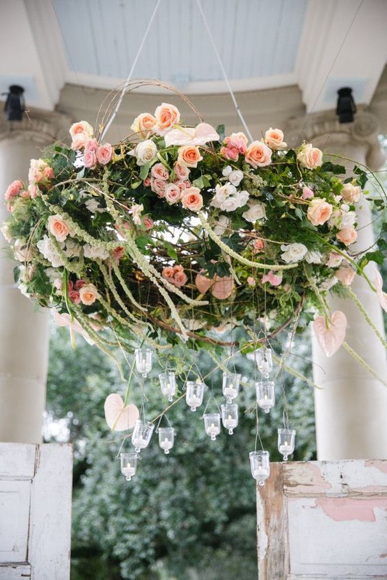28 blush rose chandelier with candle holders has a strong wow factor