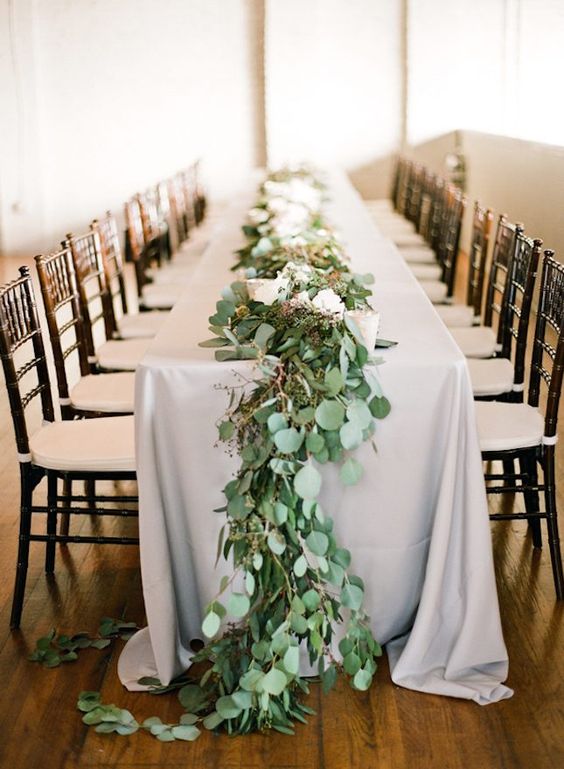 eucalyptus table garland with berries can substitute any centerpiece