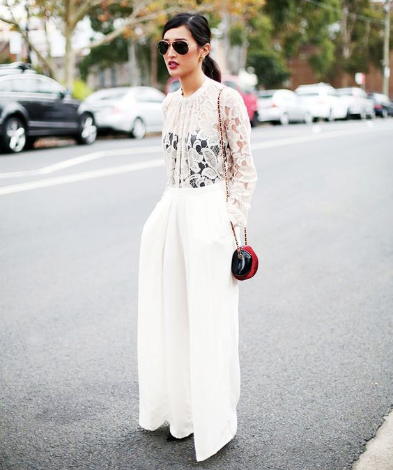 wide pants with a lace top and a black corset