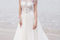 29 bejeweled bodice  with cap sleeves and a flowy skirt