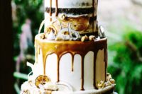 29 gold boho wedding cake with caramel drip, candied lemon and shaved coconut