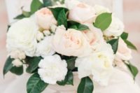 30 cream and blush flower centerpiece with green leaves