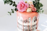 31 chocolate semi naked wedding cake with pink drip, fresh greenery and flowers