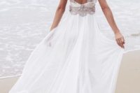 31 flowy wedding dress with a cutout back and a beaded bodice