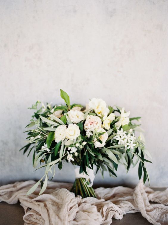 messy textural bridal bouquet wwith lots of greenery looks very refreshing