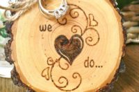 31 rustic wedding ring holder with wood-burnt decor