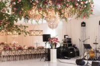 33 bold flower chandeliers over the dance floor to highlight it