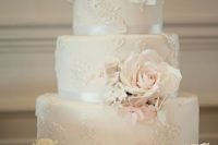 36 refined neutral lace wedding cake topped with blush flowers