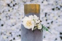 38 concrete and gold metallic wedding cake decorated with white flowers