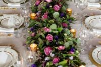 38 wedding tablescape with a lush colorful floral garland