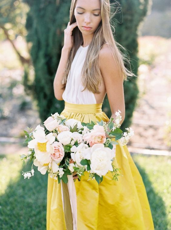 sunny yellow midi skirt and a white top
