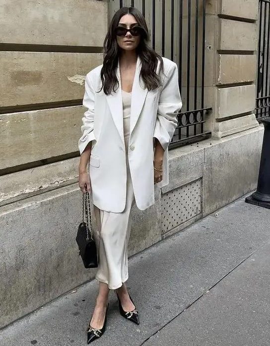 a classy modern bridal shower look with a slip dress, an oversized white blazer, black shoes and a black bag